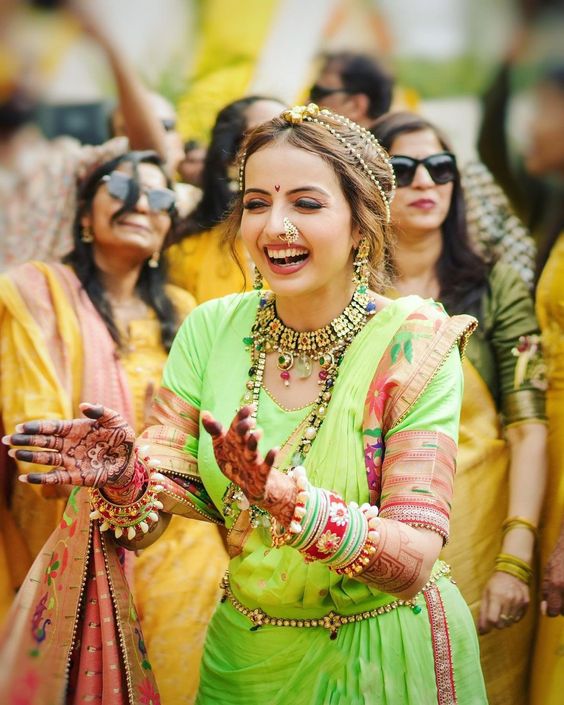 Mehndi is celebrated with laughter, dance, and music.