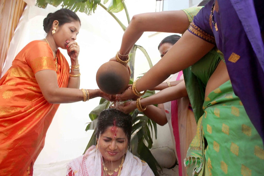 Pani Tola is a ritual common in Assamese wedding.