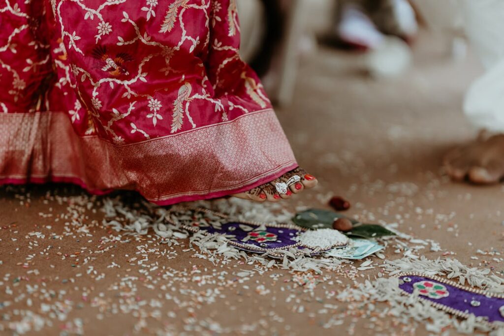 Bride and groom take vows through Saptapadi.