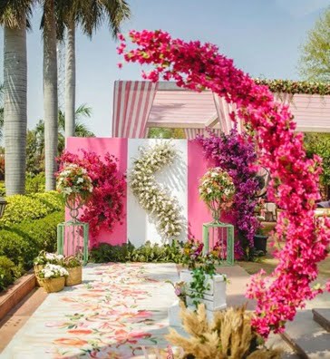 Photo booths against a floral backdrop can add color to your wedding.