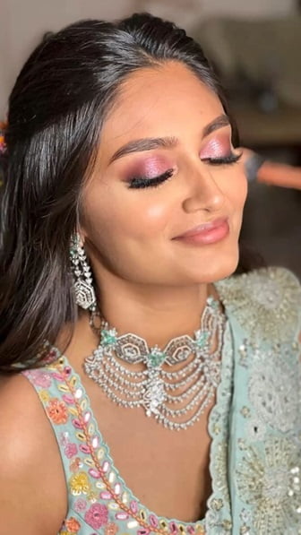 Soft pink eyelids, a little mascara, and pink lips will be perfect for a haldi or sangeet event.