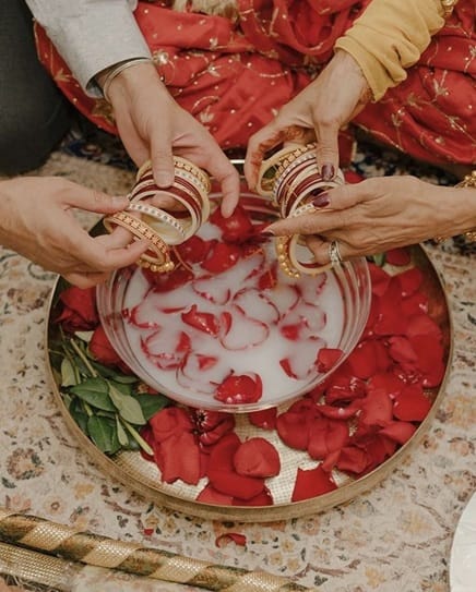 The bangles are dipped in milk and rose petals.