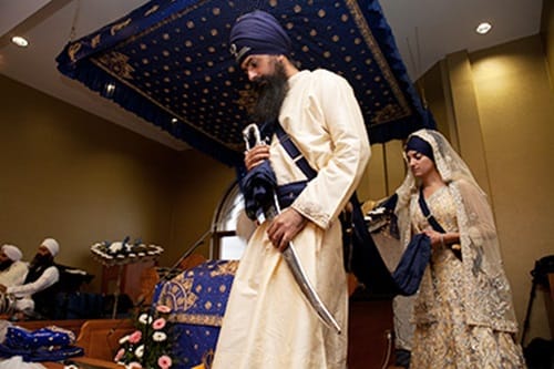 It refers to the couple’s circumambulation around the Guru Granth Sahib.