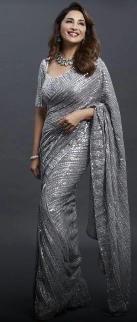 A dazzling sequin saree adds the perfect glamorous touch.