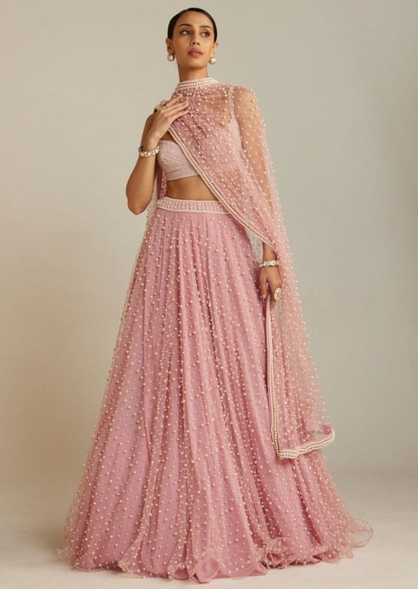 A floor-length lehenga may help you embrace tradition and contemporary elegance. 